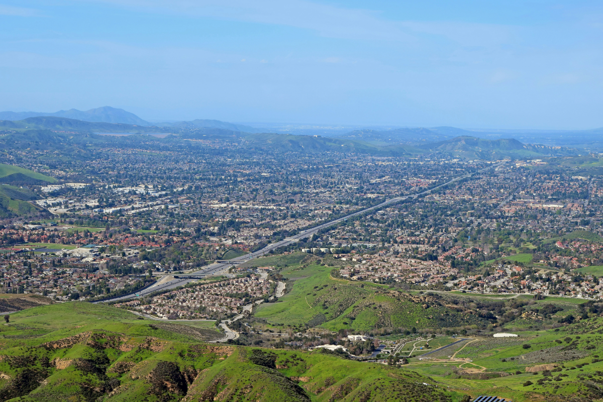 Aerial view of Simi Valley surrounded by green hills, the calm Ventura County setting near detox care in Santa Clarita